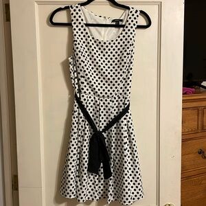 Black and white dress . Size medium. Back zipper and black lash around waist.